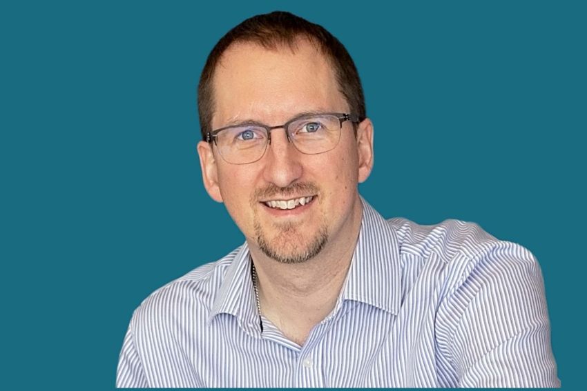 Mike smiling into the camera